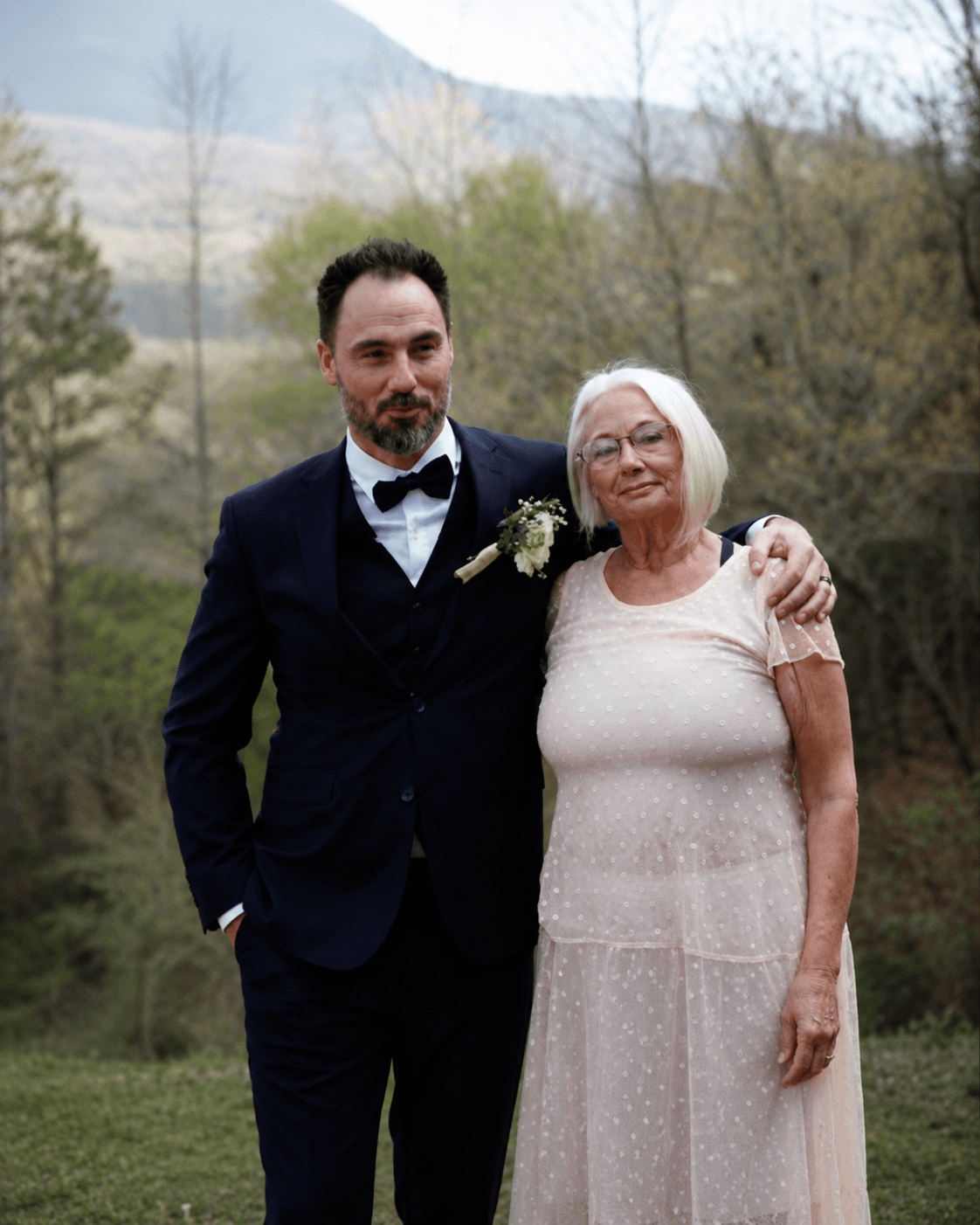 Carlene with her son Joshua, outdoors on a spring day